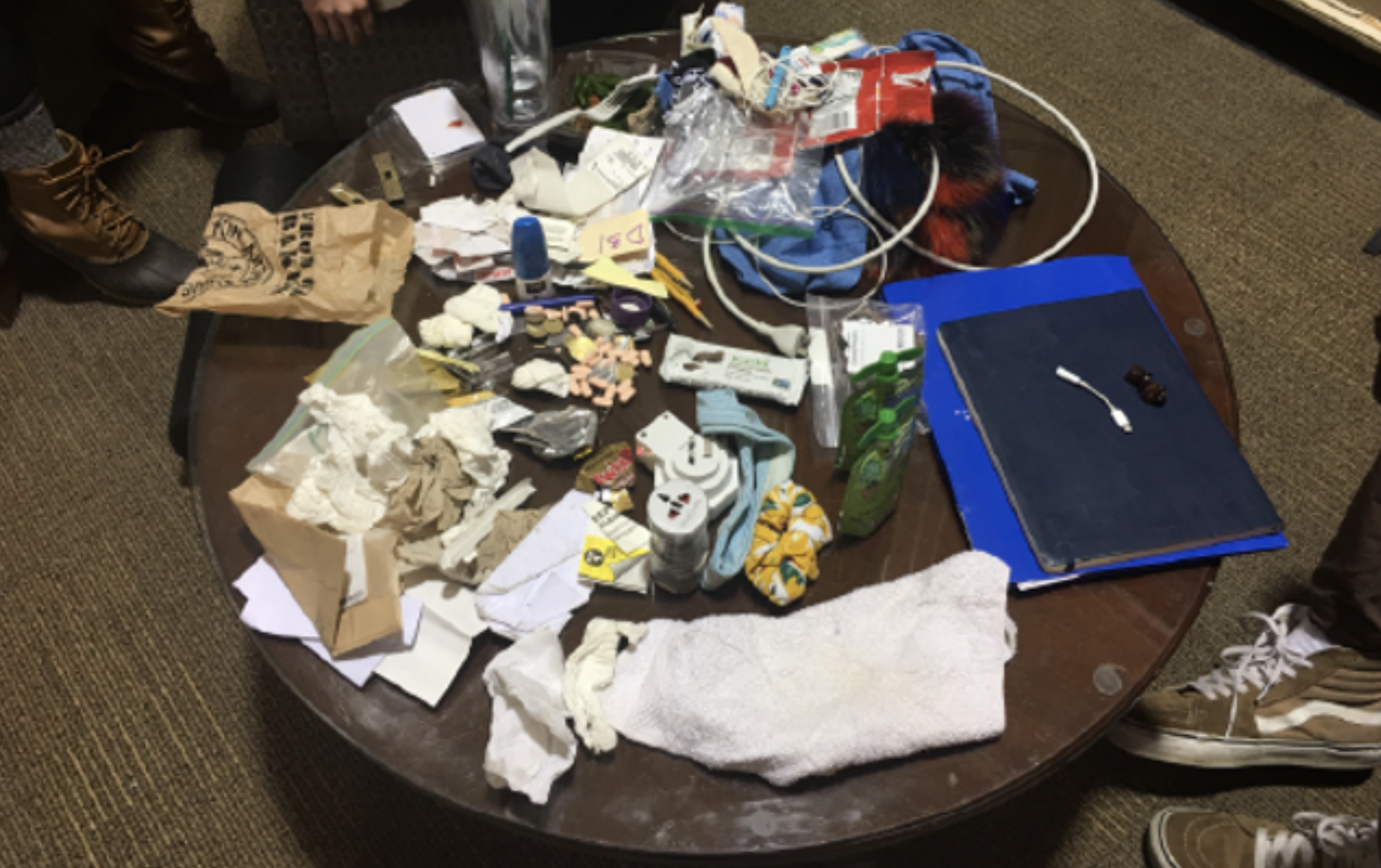 A round table completely covered in clutter