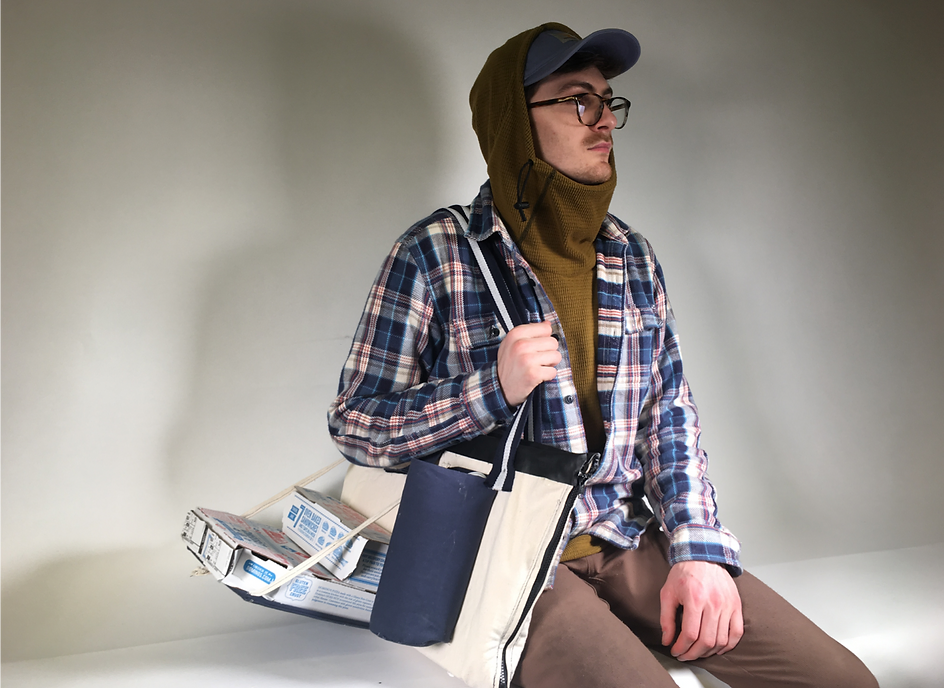 The prototype bag being worn by Aidan against a white background.